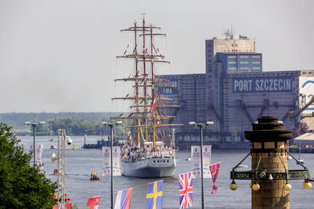 Szczecin, Poland Aug 2013 The Tall Ships Races, tall ship Dar Mlodzierzy leaving the harbourのeditorial素材