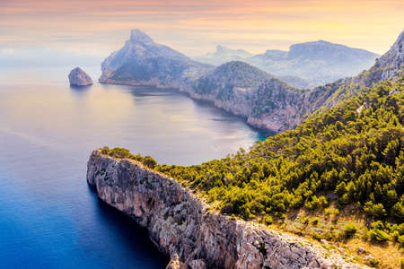 View from the Mirador Es Colomer towards the island Colomer and the mountain range on Formentor peninsula, beautiful sunset, Mallorca, Spainの写真素材
