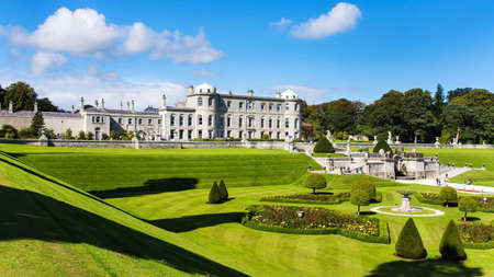 Tourists visiting Powerscourt Gardens one of the most beautiful gardens in Ireland view on mansion from terraced lawnのeditorial素材