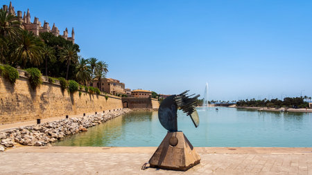Palma, Mallorca, Spain, June 2015 An abstract sculpture in front of The Cathedral of Santa Maria of Palma in Mallorca with fountain and pond in frontのeditorial素材