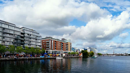 Dublin, Ireland, May 2016 Festival or Sunday market at Dublin Docklands. River Liffey with modern buildings on the banks.のeditorial素材