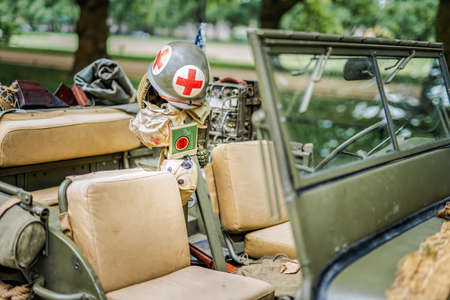 Szczecin, Poland, June 2018 Interior of retro Jeep Willis from American Vietnam war or World War 2 with vintage equipment, accessories and camouflageのeditorial素材