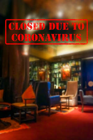 Defocused, blurred view of interior of an upmarket cafeteria or coffee shop, empty and closed due to coronavirus or covid 19 pandemicsの写真素材