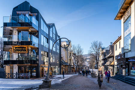Zakopane, Poland, March 2019 Famous Krupowki promenade, main shopping area in Zakopane. Winter time. Zakopane is called a winter capital of Polandのeditorial素材