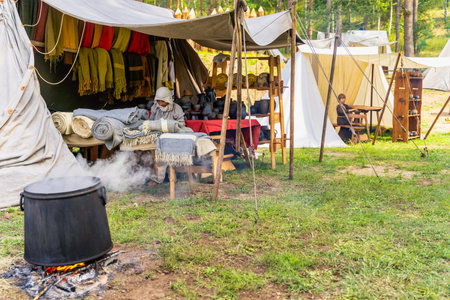 Cedynia, Poland, June 2019 Historical reenactment of Slavic or Vikings tribe tent camp, exhibiting dyeing fabrics and villagers life in 11th centuryのeditorial素材