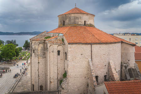 Panoramic view on St. Donata, circular church in early Romanesque architecture style in Zadar with Adriatic Sea in the background, Croatiaの写真素材