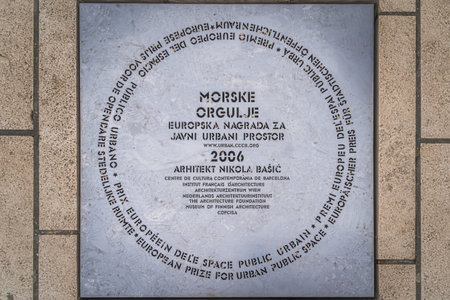 Zadar, Croatia, July 2019 Sea organ, Morske orgulje, a metal information tile with curved letters