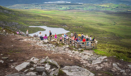 Enniskillen, Northern Ireland, August 2019 People admiring a beautiful view from viewing point or observation platform in Cuilcagh Mountain Parkのeditorial素材