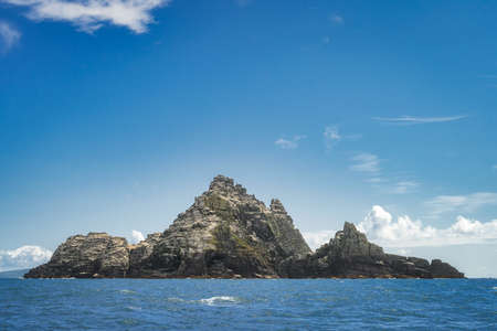 Little Skellig a rocky island on Atlantic Ocean close to Irish shore, habitat for thousands of seabirds Gannet, Morus Bassanus, Ring of Kerry, Irelandの写真素材