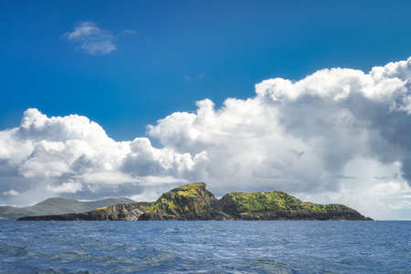 Beautiful, rough Irish coastline, Kerry Cliffs, seen from boat on Atlantic Ocean, Portmagee, Iveragh Peninsula, Ring of Kerry, Irelandの写真素材