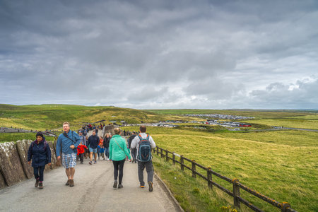 Doolin, Co. Clare, Ireland, August 2019 Crowd of tourists visiting iconic Cliffs of Moher, main visitor centre and car parking full of busses and carsのeditorial素材