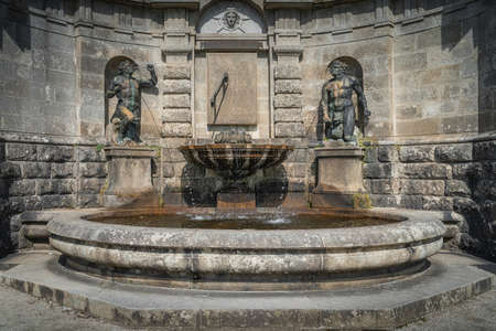 Circular pool with fountain, sculptures and sun clock in Powerscourt estate, Enniskerry, Wicklow, Irelandのeditorial素材