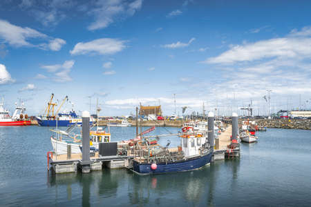 Small fishing boats moored in Howth harbour. Phishing and shellfish fishing equipment on fishing boats, Dublin, Irelandの写真素材