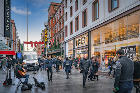 Dublin, November 2019 Henry Street decorated for Christmas with people in festive mood. The Spire on OConnell street visible in backgroundの写真素材