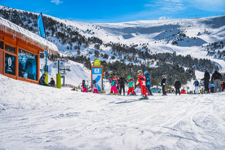 El Tarter, Andorra, Jan 2020 Ski instructors with a group of young kids at assembly point. Winter holidays in Pyrenees Mountainsのeditorial素材