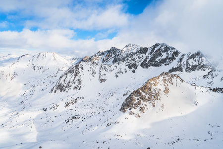 Dramatics mountain landscape with snow capped rocky Pyrenees mountains. Ski winter holidays in Andorra, El Tarter, Grandvaliraの写真素材