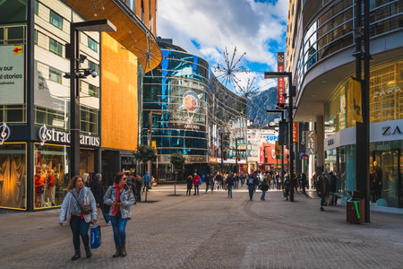 Andorra la Vella, Andorra, Jan 2020 People duty free shopping, street with modern shops and restaurants. Capital city in Pyrenees Mountainsのeditorial素材