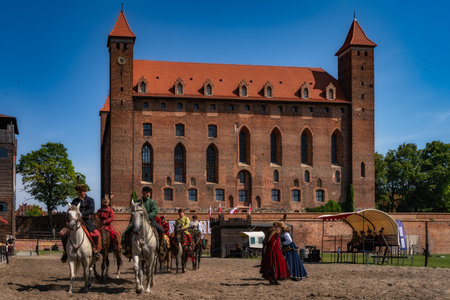 Gniew, Poland, Aug 2020 Polish Hussars, horseman warriors at Castle Gniew courtyard, horseback riding show, historical reenactmentのeditorial素材