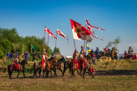 Gniew, Poland, Aug 2020 Polish hors cavalry, Hussars, riding on a battlefield with pendants and flags, historical reenactment of Battle of Gniewのeditorial素材