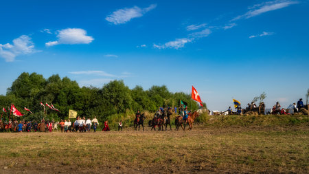 Gniew, Poland, Aug 2020 Polish hors cavalry, Hussars, riding on a battlefield with pendants and flags, historical reenactment of Battle of Gniewのeditorial素材