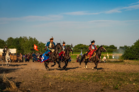 Gniew, Poland, Aug 2020 Horse riders, the hussars, polish heavy cavalry riding through the battlefield, historical reenactment of Battle of Gniewのeditorial素材