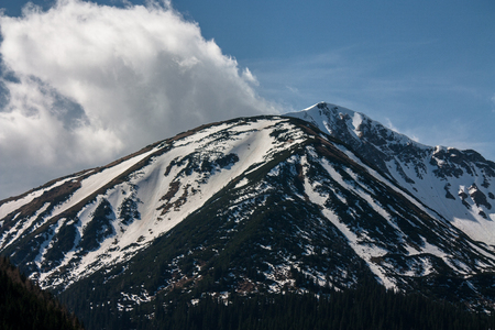 mountain peak with blue sky in the backgroundの写真素材