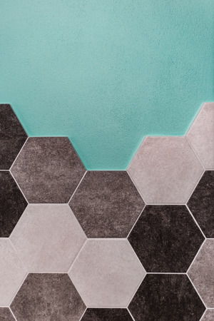 large hexagonal background. Concrete structure, shades of gray. Close-up of hexagon tiles in kitchen.の写真素材
