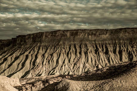 Unusual rock formation produced from erosion make up the surreal landscape near Factory Butte  Utahの写真素材