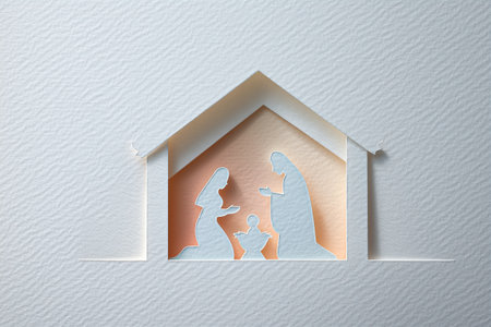 Minimalist paper cut-out Nativity scene featuring the Holy Family in a stable for Christmas celebration.の素材