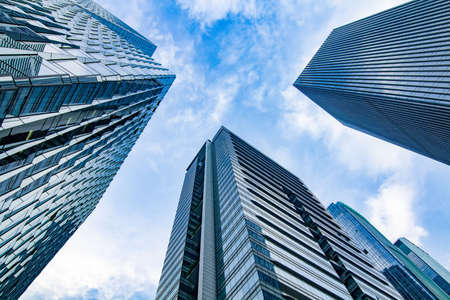 Low angle view of modern office buildingの写真素材