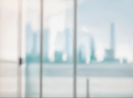 Blurred abstract glass wall from building in city town background. High quality photoの写真素材