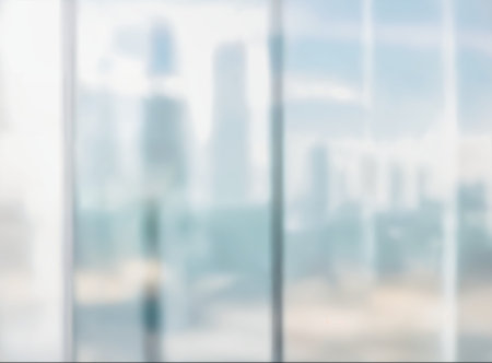 Blurred abstract glass wall from building in city town background. High quality photoの写真素材