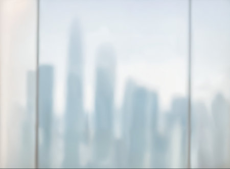 Blurred abstract glass wall from building in city town background. High quality photoの写真素材