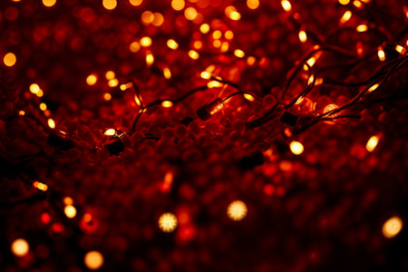 Red Christmas baubles decoration on red background. New Year party background. Minimal style. Flat lay. High quality photoの素材