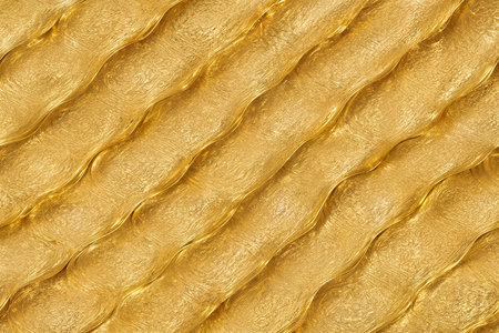 Gold foil texture background with highlights and uneven surface. High quality photoの写真素材
