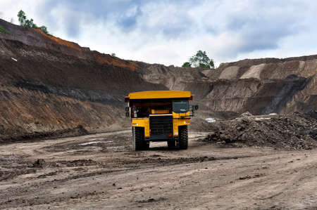 Big Truck Coal Mine hauling material through in the mining roadの写真素材