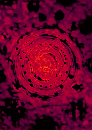 Bloody red vortex with black background.の写真素材