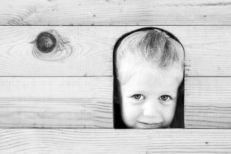 Little happy girl on the playground. Black and white series.の写真素材