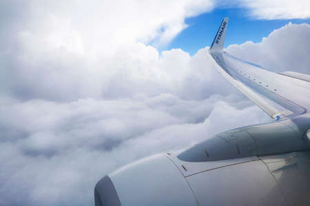 Tenerife, Spain - June 06, 2019: Ryanair airline wing. Sky view from the airplane window.のeditorial素材
