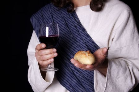 Jesus Christ holding out the wine and bread of communionの写真素材