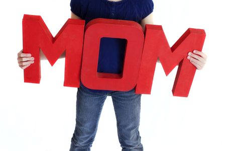 child holding a sign that says momの写真素材