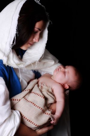 Mary holding a sleeping baby Jesusの写真素材