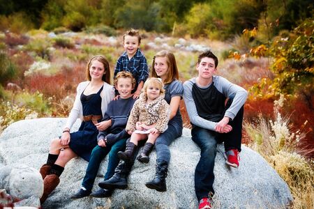 group of 6 children, toddler to teen, in Fall settingの写真素材