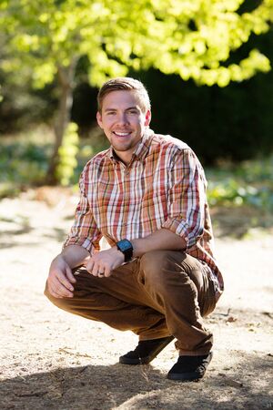 handsome young man outdoorsの写真素材