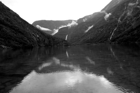 Fjord in Norway. Reflection in water. Black and white.の写真素材