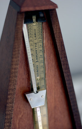 Metronome on a wooden standの写真素材
