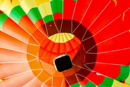 A balloon in the air as seen from below. bright, saturated colorsの写真素材