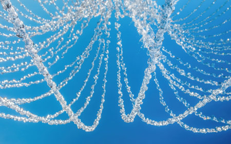 Water jets on a blue background. Frozen Moment