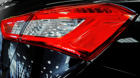 Taillight modern car. Close-up. Black, Red, Whiteの写真素材