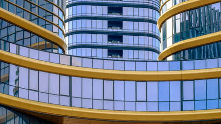 Facade of modern building. Glass and metal. Gold and dark blueの写真素材